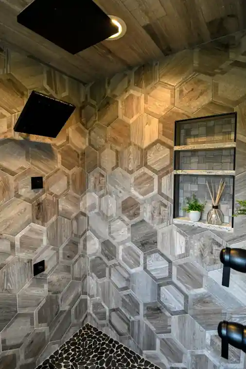 After: the shower rebuilt in hexagon tile