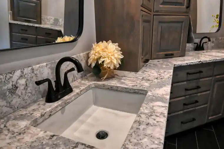 After: the matching vanity wall in the hexagon-tile bathroom