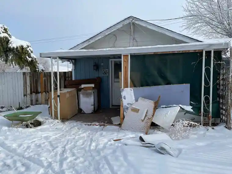 Before: the Selah cottage in winter with snow on the ground
