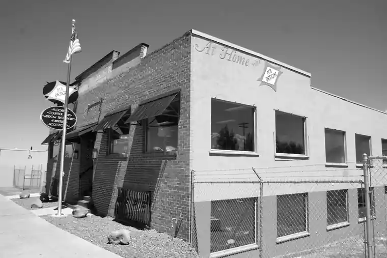 Black and white archival street view of the McIlvanie Machine Works building
