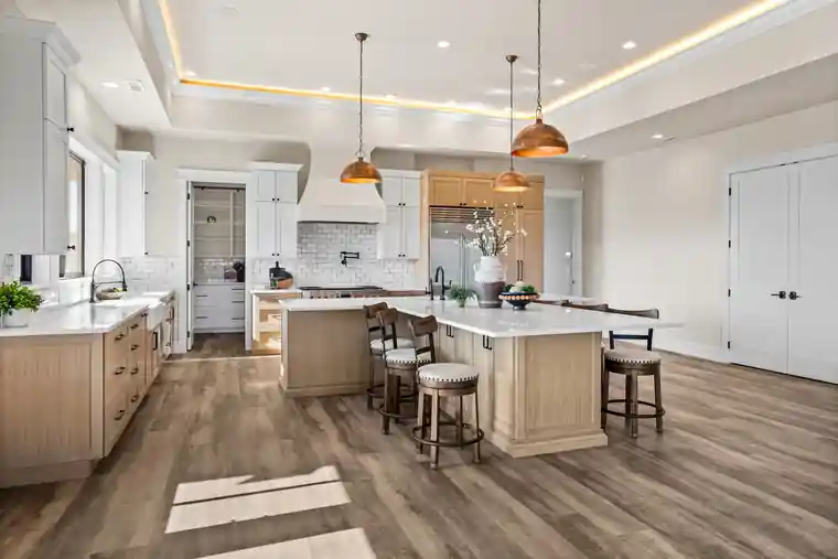 Bright white kitchen with a timber island from the Lust Tour of Homes 2026 house