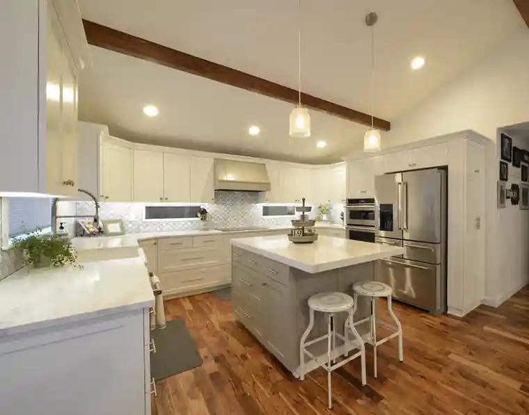 Hartman kitchen with white cabinetry and exposed beams