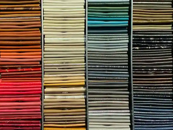 Fabric sample wings in a rainbow of colours hanging in the showroom