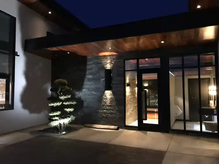 Perry Home entry with stacked stone at dusk